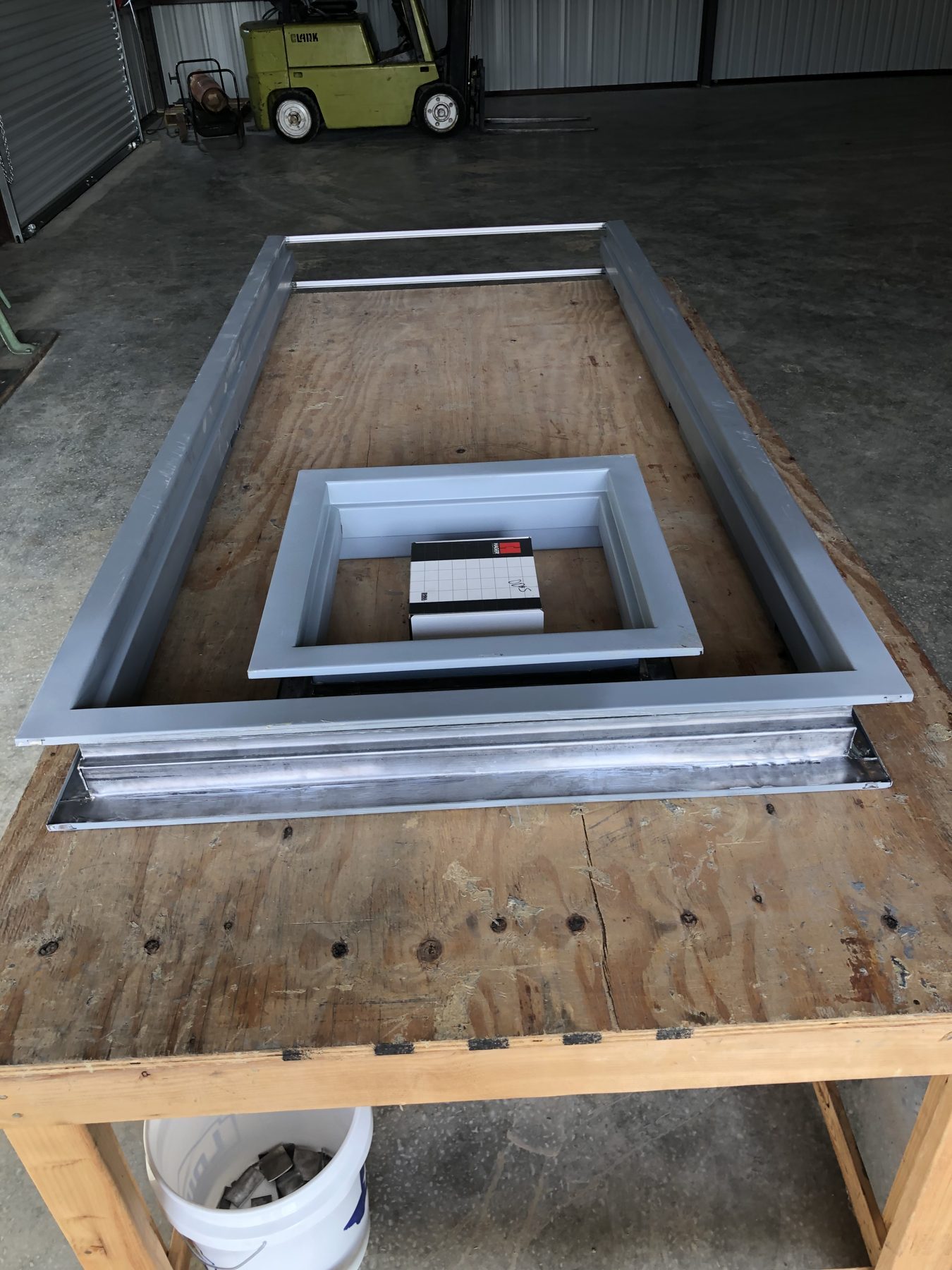 Custom lead-lined panel with framed opening.